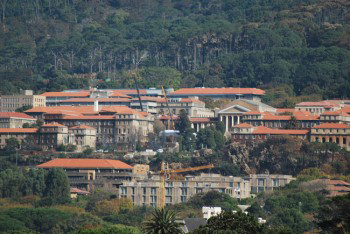 Construction cranes begin reconstruction repairs amid scorched buildings on the University of Cape Town campus .