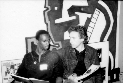 black and white photo of Martin lovis in conversation with Mr Philip (Phil) Buchanan of the Black Music Association, London 1983