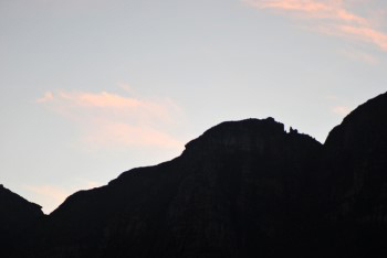 Nursery buttress at sundown behind in dark sillouette clearly showing the cockerel and chicks outlined on the horizon.