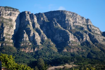 The buttresses on cold clear sunlit morning four with blue shadows showing the face in sharp almost African ceremonial mask like appearance.