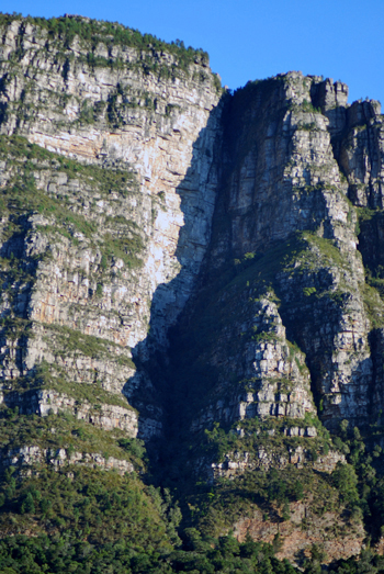 The African human shadow face profile that appears, just after dawn, around the Autumn equinox on the east side of the Table Mountain range in Cape Town South Africa, photo by Martin Lovis, 2020